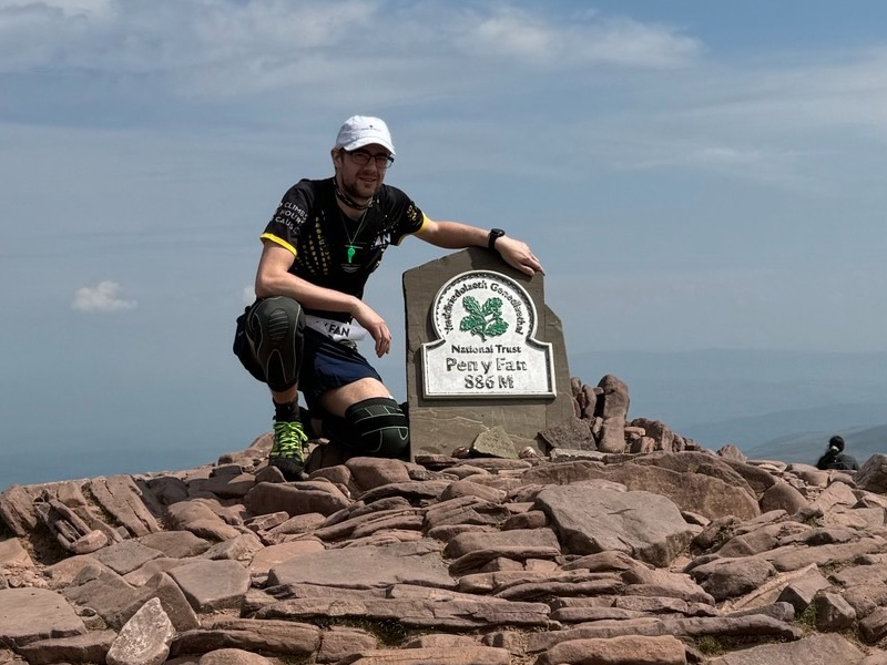 Luke at the summit of Pen Y fan having completed nine climbs in 24 hours