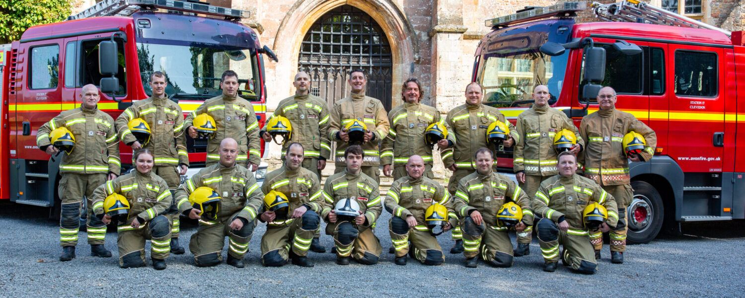 Firefighters from Clevedon Fire Station in front of two fire engines.