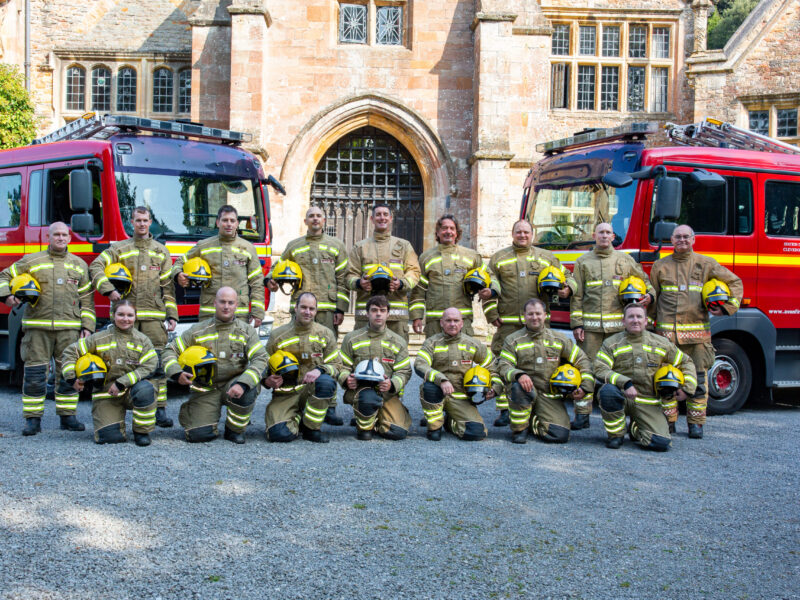 Firefighters from Clevedon Fire Station in front of two fire engines.