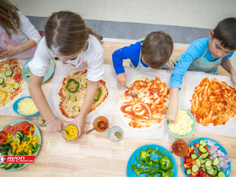 children making pizza in the kitchen